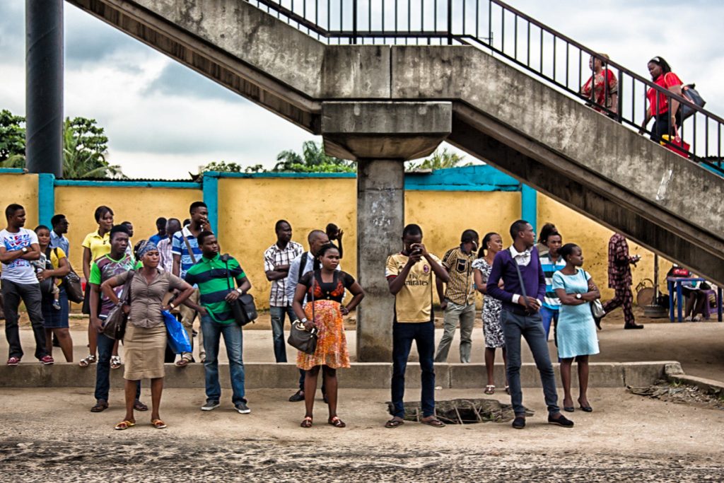 people standing in a bus stop in lagos